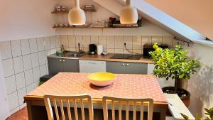 a kitchen with a table with a bowl on it at Samobor Old Town Studio by the River in Samobor