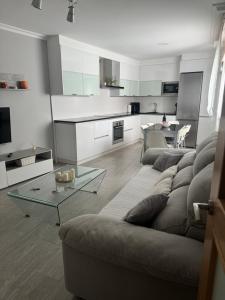 a living room with a couch and a table at Apto Pepi´s House in Sanxenxo