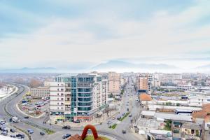 an aerial view of a city with traffic at Luxury City View Apartments with Balcony & Kitchen & Fast Wi-Fi in Shkodër