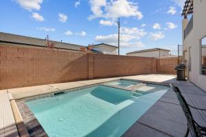 a swimming pool in the backyard of a house at Zion Adventure townhouse in Hurricane +52 photos