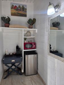a kitchen with a counter and a microwave in a room at Sequoia Village in Three Rivers