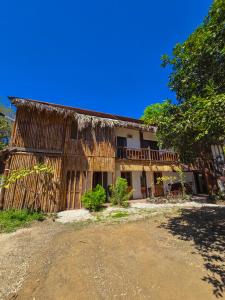 an old house with a thatched roof at Tyler's place in Coco