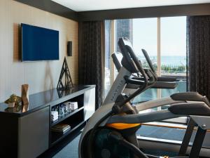 a hotel room with a gym with a treadmill at Loews Chicago Hotel in Chicago