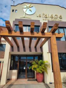 a building with a sign on the front of it at Hotel la Palapa Mazatlan in Mazatlán +4 photos