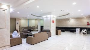 a person sitting in a waiting room at a hospital at Maidan Al Bait in Mecca