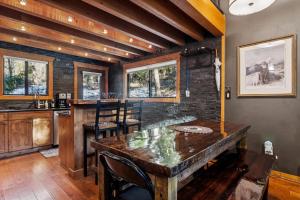 a kitchen with a large wooden table and chairs at Creekside Retreat in Whitefish