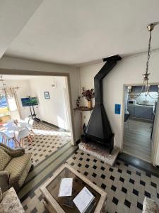 a living room with a fireplace and a table at Casa Dos Avenidas 4 Dormitorios in Montevideo