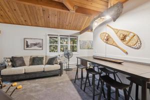 a living room with a couch and a table at Nordic Nook in Whitefish