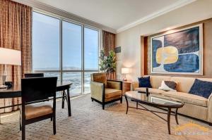 a living room with a couch and a table at MGM Signature 34-818 Jacuzzi Studio Upper Penthouse in Las Vegas