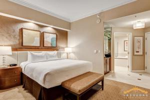 a large bedroom with a large bed and a table at MGM Signature 34-818 Jacuzzi Studio Upper Penthouse in Las Vegas +44 photos