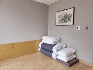a stack of pillows in a room at Mudeung Park Hotel in Gwangju