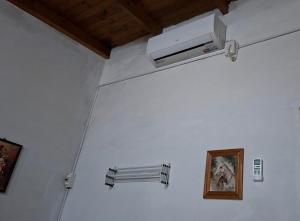 a room with a white wall with a air conditioner at Posada Ernesto in Rauch