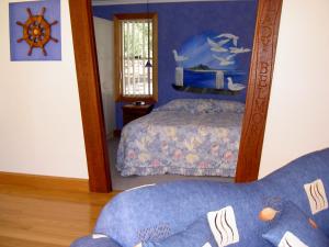 Ένα ή περισσότερα κρεβάτια σε δωμάτιο στο Bewong River Retreat