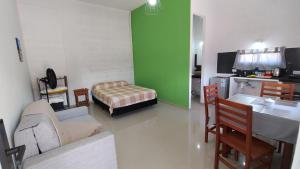 a living room with a couch and a table and a bed at Viva apart in Fiambalá +6 photos