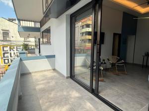 a balcony of a building with sliding glass doors at Living Sincelejo in Sincelejo