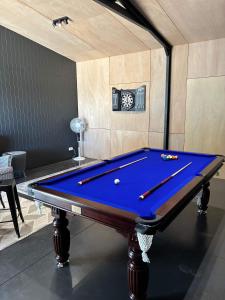 a pool table in a room with at Sunset Views in Wellington East
