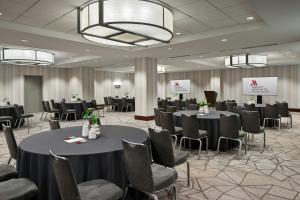 a conference room with tables and chairs in a room at Washington Marriott at Metro Center in Washington, D.C. +84 photos