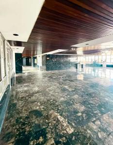 a lobby with a marble floor and a pool at Beachfront Bliss at Isla Verde in San Juan