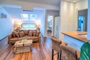 a living room with a couch and a table at Seaside-Townhouse in Timmendorfer Strand
