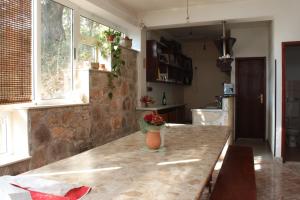 a kitchen with a table with a vase on it at Apartments by the sea Luka - Dugi otok - 441 in Luka