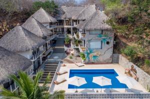 an aerial view of a resort with a swimming pool at Sicaru Mazunte in Mazunte