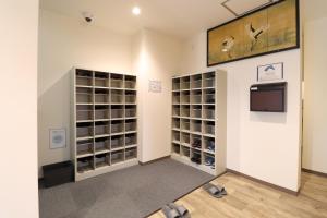 a room with two large closets with shoes at SWELL in Hyuga