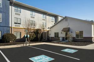 a parking lot in front of a building at City Express by Marriott Danville in Danville