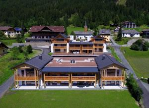 an aerial view of a large building with a large at Premium Apartments am Weißensee in Weissensee