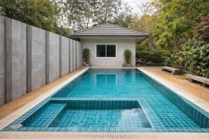 a swimming pool in the backyard of a house at Rayong Valley Resort in Ban Khao Chak Khaek (1) +26 photos