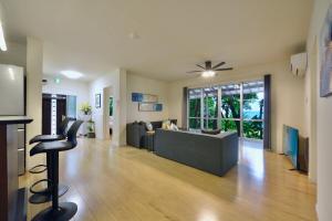 a living room with a couch and a table at 064Villa 美海璃 in Nanjo