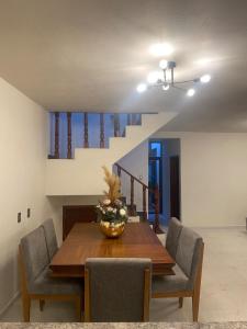 a dining room with a wooden table and chairs at Casa Mexiquito in Arandas