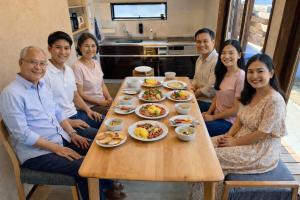 a group of people sitting around a table with food at Three Maples Fujiyoshida in Fujiyoshida +61 photos