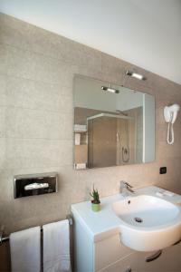 Koupelna v ubytování Hotel Milano Palmanova + 32 fotografií
