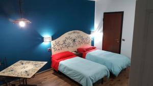Postel nebo postele na pokoji v ubytování B&B La Tartaruga
