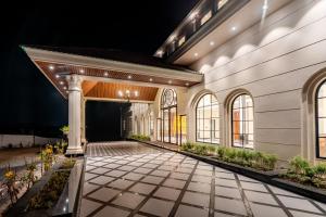 an empty courtyard of a building at night at Playotel Premier, Ujjain in Ujjain