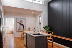 a kitchen with a sink and a counter top at Sixty - House 1 in Currie