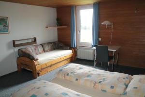 Postel nebo postele na pokoji v ubytování juhui Lenzerheide