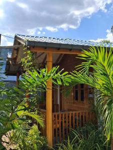 a house with a deck with a gazebo at Beach cabin uppuveli in Trincomalee +8 photos
