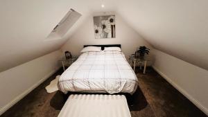a bedroom with two beds in a attic at Waterside annexx in Durham