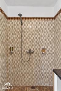 a shower with a shower head in a bathroom at The Bingin Green View by Bukit Vista in Uluwatu +22 photos