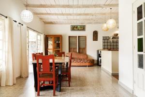 a kitchen and dining room with a table and chairs at Villa Pondok Terra in Yogyakarta