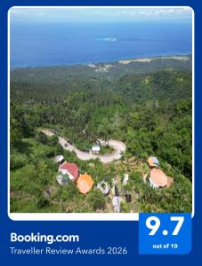 an aerial view of a resort with the ocean at Romantic Stone House with STARLINK internet 700 meters above sea level Eco-Farm in Mambajao +59 photos