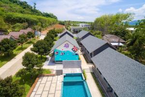 an aerial view of a house with a swimming pool at Be Leaf Resort SHA in Thalang