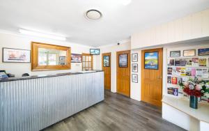 a lobby of a restaurant with a counter at Ben Chifley Motor Inn in Bathurst