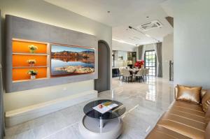 a living room with a couch and a table at Golden Terra Villa in Phan Thiet