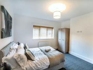 a bedroom with a bed and a window at Woods Terrace in Gainsborough +2 photos