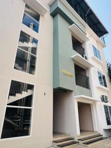 a building with white and blue at City Creek in Perintalmanna