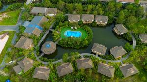 an aerial view of a villa with a river and houses at Good Time Relax Resort in Kampot