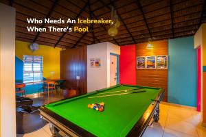 a pool table in a room with a caption who needs an icelander when at goSTOPS Coorg in Madikeri