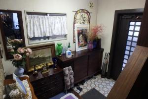 a living room with a dresser and a mirror at KazenoKi in Kichijōji +27 photos